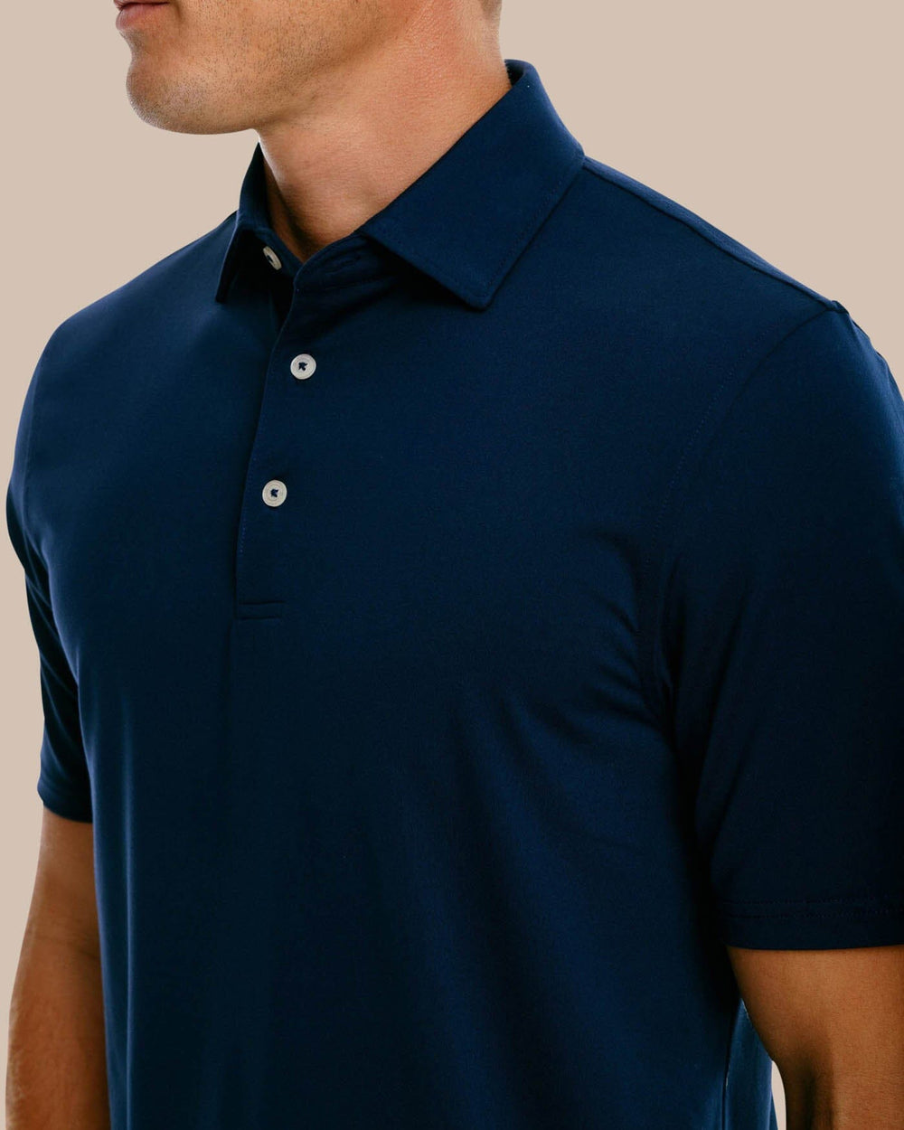 The collar of the Men's Ryder Performance Polo Shirt by Southern Tide - True Navy