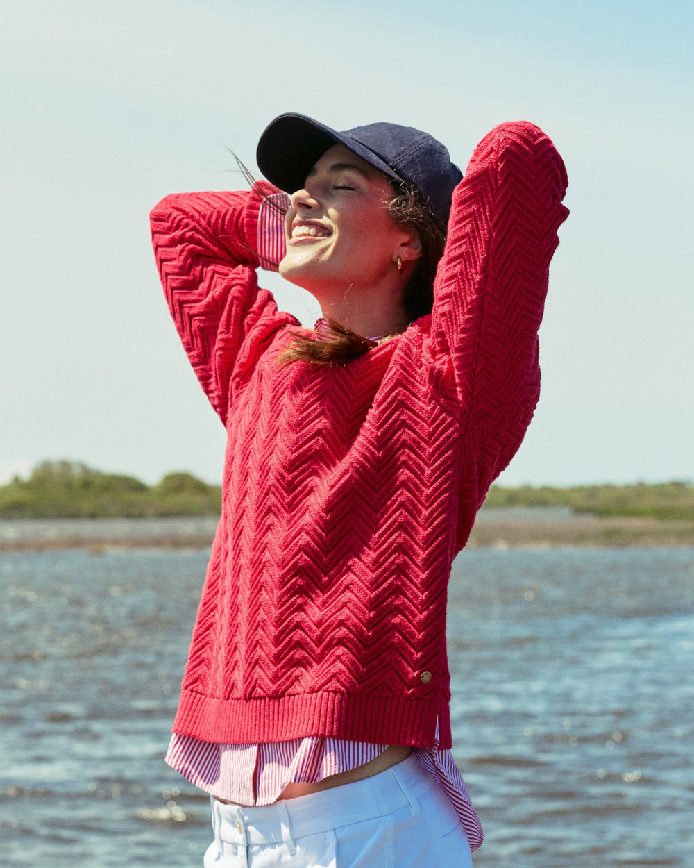 The lifestyle view of the Southern Tide Saige Sweater by Southern Tide - Grenadine Red