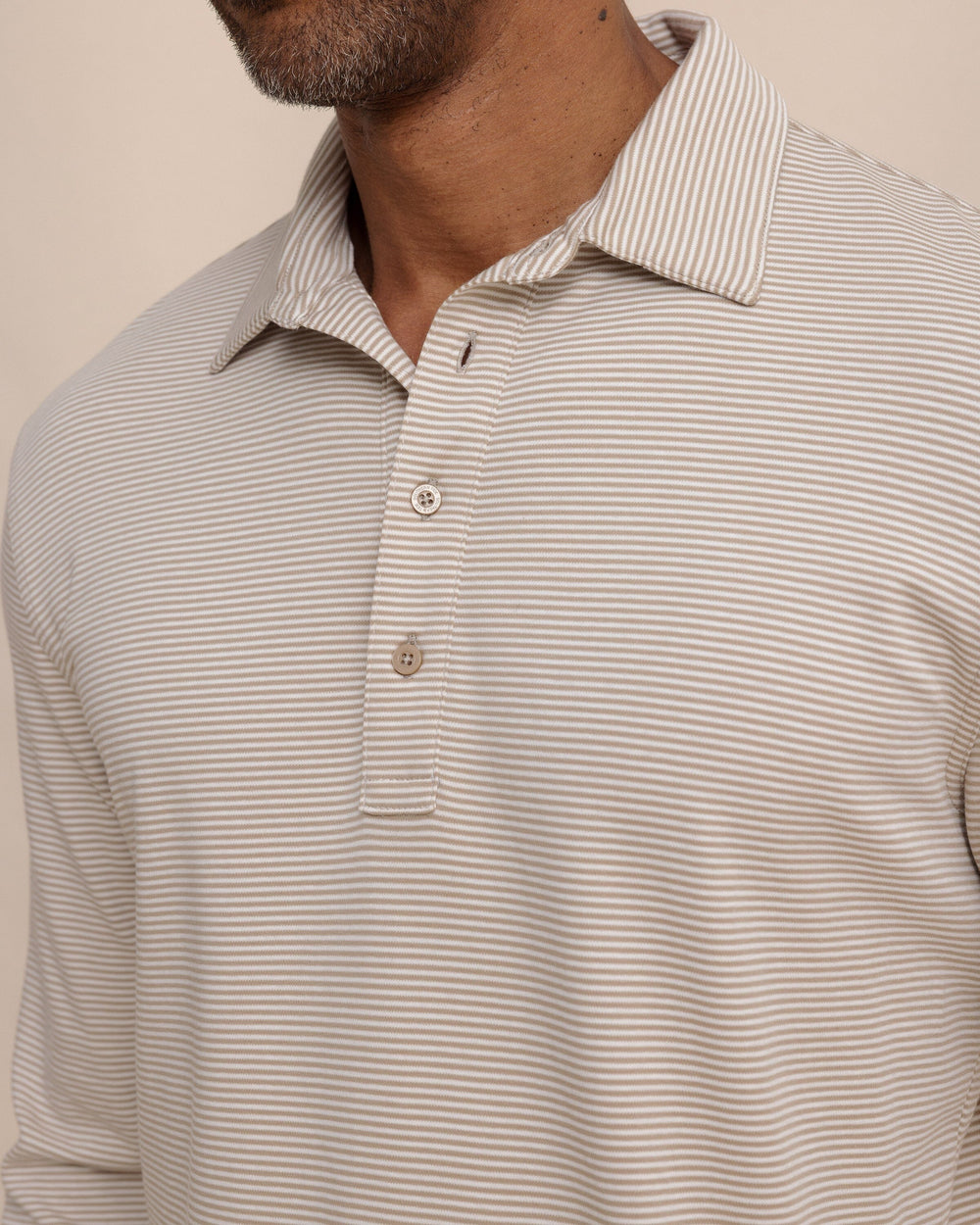 The detail view of the Southern Tide Sandy Cay Long Sleeve Knit Polo by Southern Tide - Sandstone Khaki