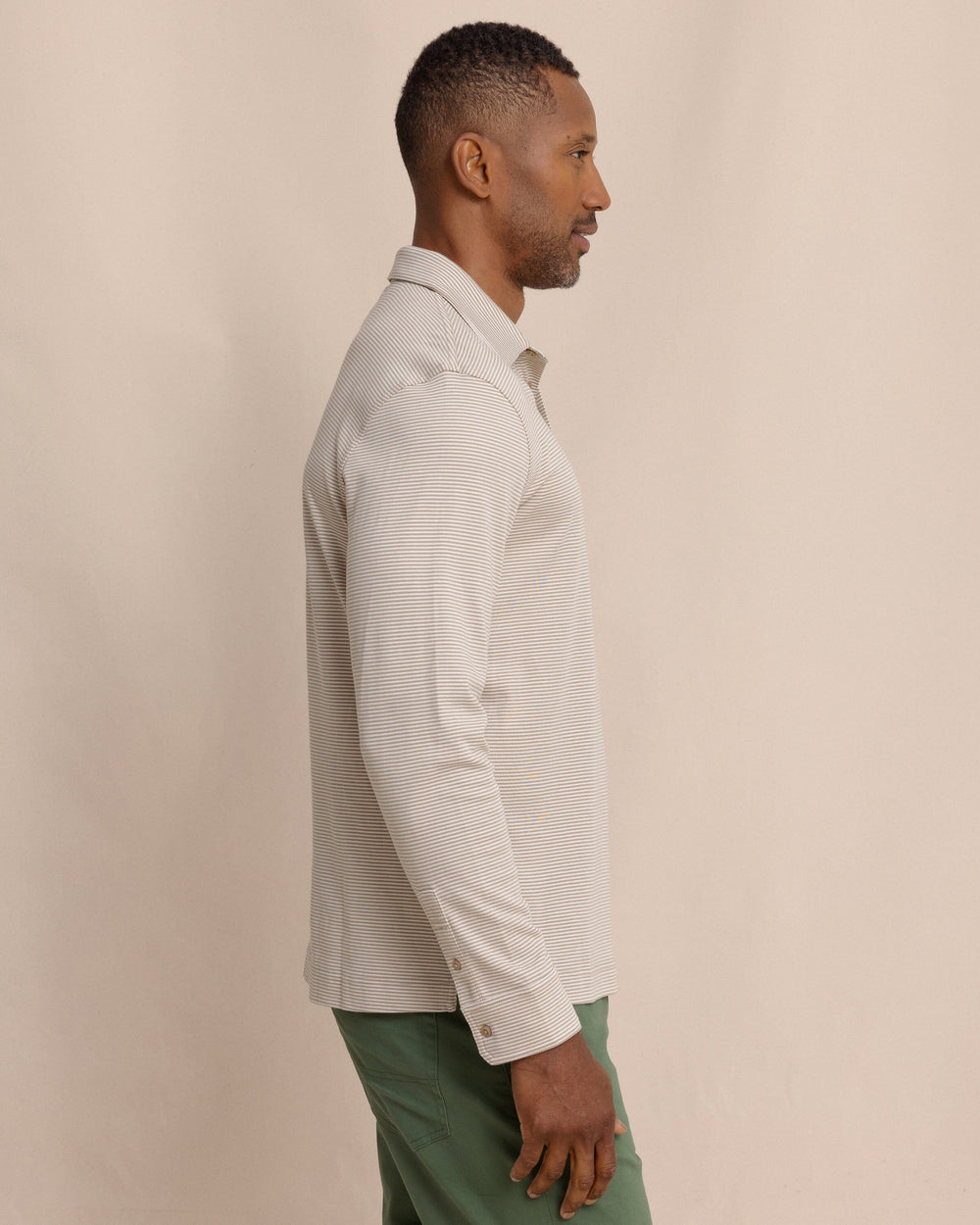 The side view of the Southern Tide Sandy Cay Long Sleeve Knit Polo by Southern Tide - Sandstone Khaki