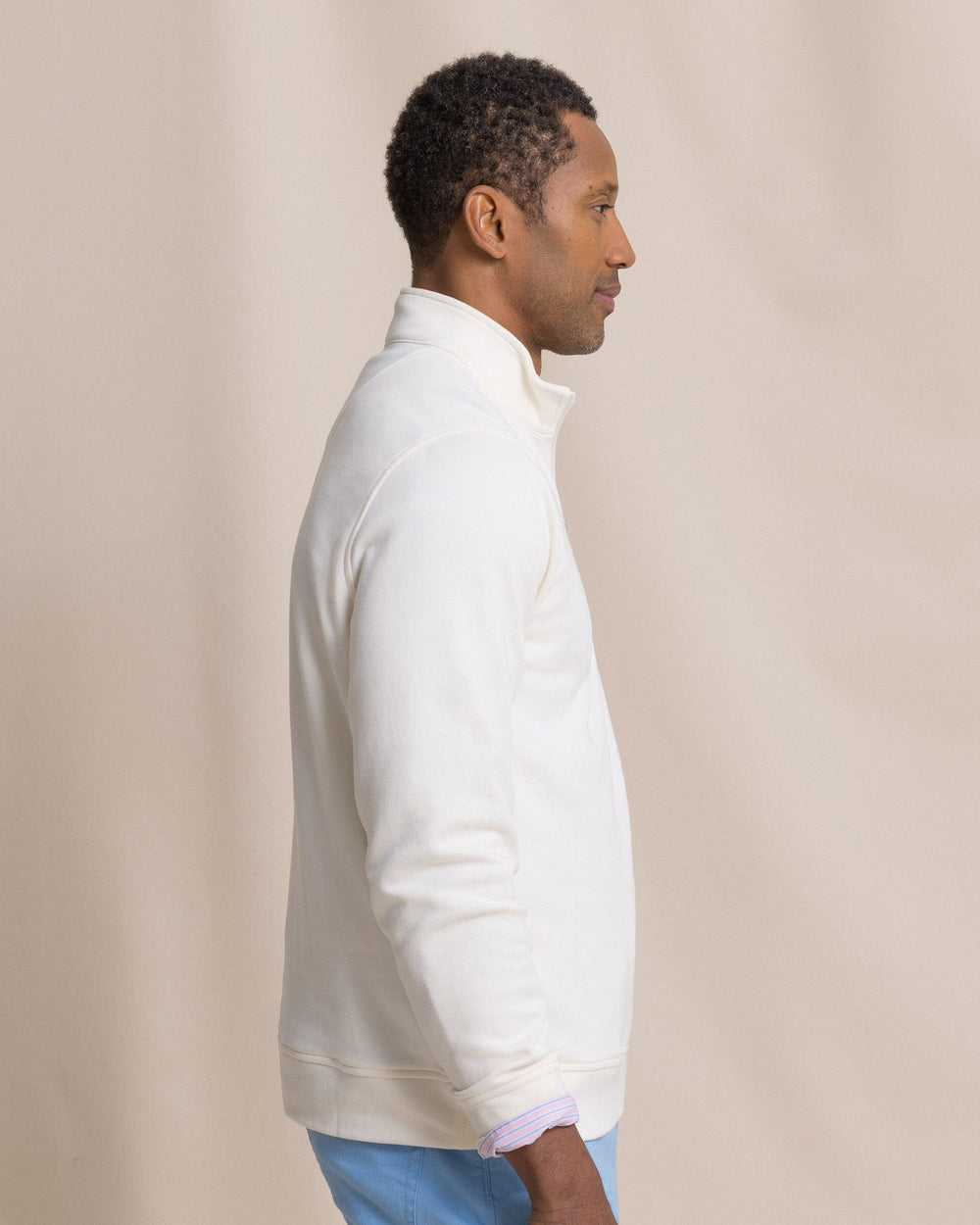The side view of the Southern Tide Sandy Cove Pique Quarter Zip by Southern Tide - Sand White