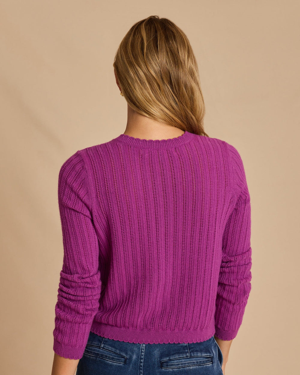 The back view of the Southern Tide Scallop Pointelle Cardigan Sweater by Southern Tide - Deep Orchid