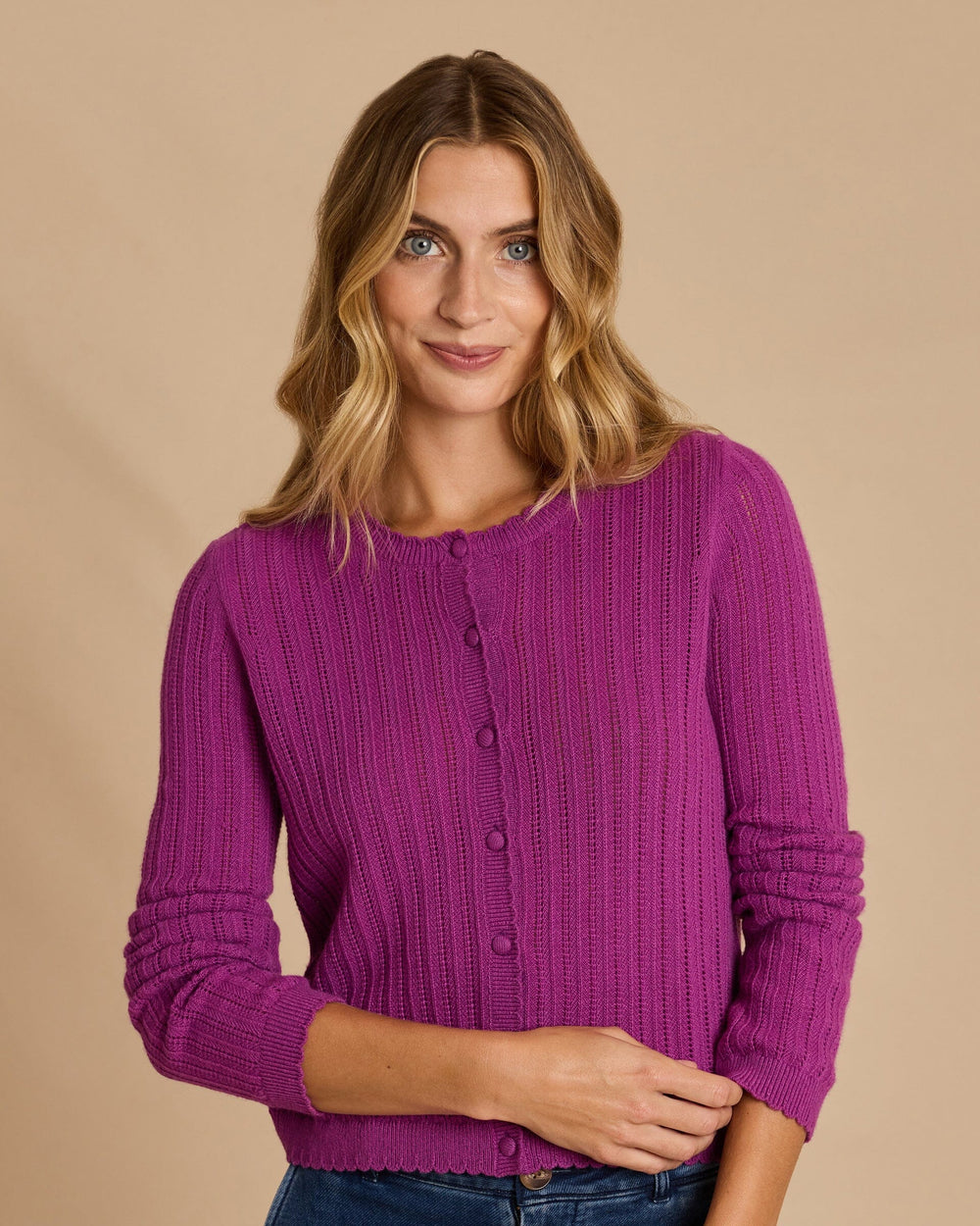 The front view of the Southern Tide Scallop Pointelle Cardigan Sweater by Southern Tide - Deep Orchid