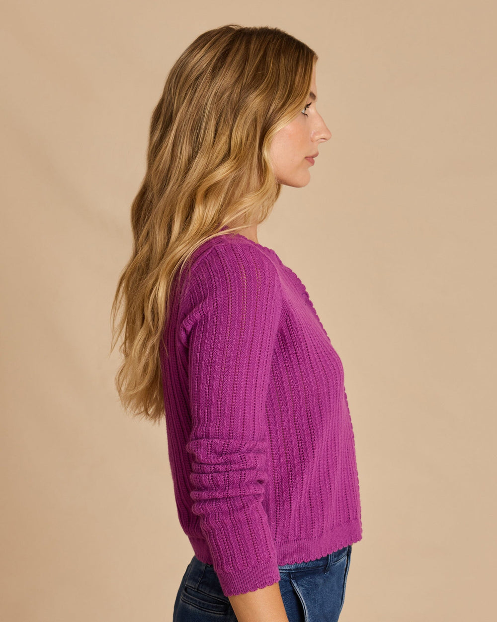 The side view of the Southern Tide Scallop Pointelle Cardigan Sweater by Southern Tide - Deep Orchid