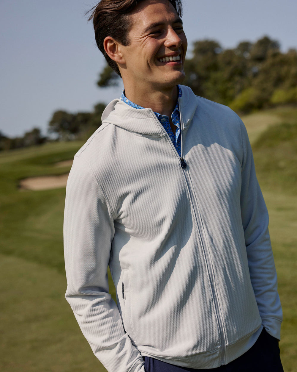 The lifestyle view of the Southern Tide Schooner Full-Zip Hoodie by Southern Tide - Silver Lake