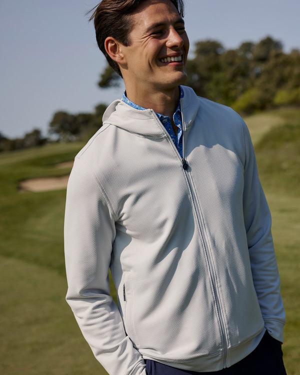 The lifestyle view of the Southern Tide Schooner Full-Zip Hoodie by Southern Tide - Silver Lake