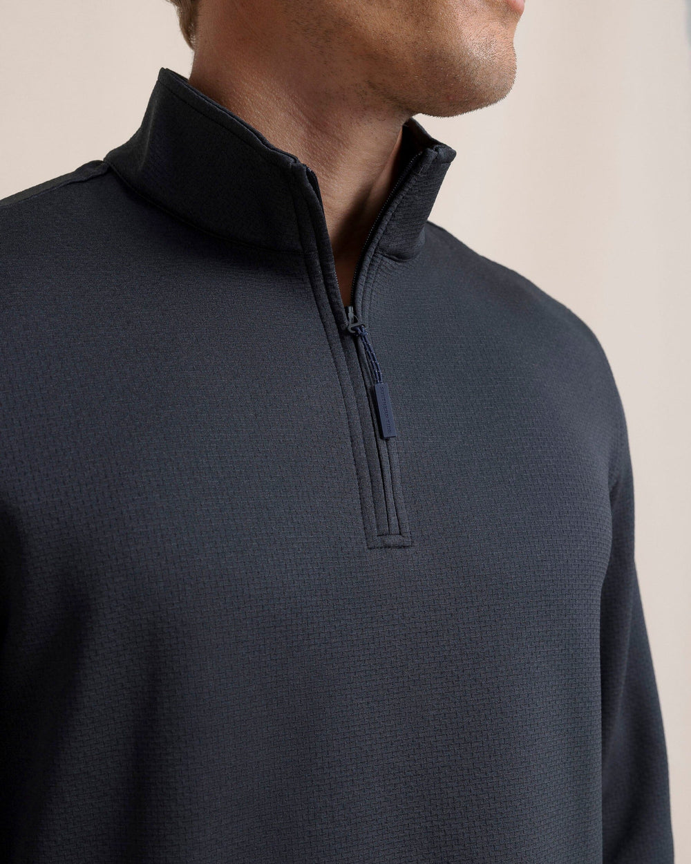 The detail view of the Southern Tide Schooner Long Sleeve Quarter Zip by Southern Tide - Caviar Black