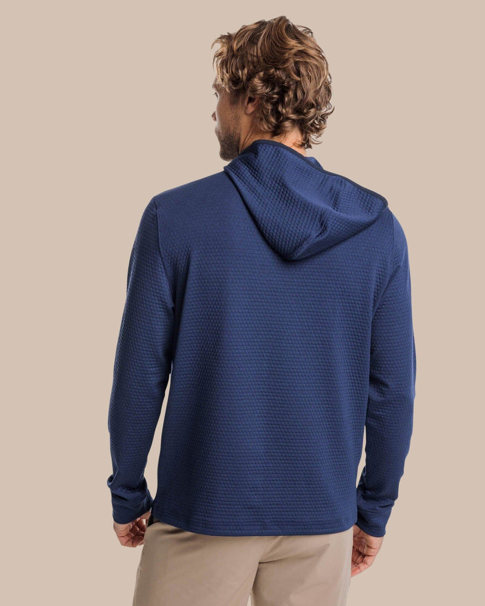 The back view of the Southern Tide Scuttle Heather Performance Quarter Zip Hoodie by Southern Tide - Heather True Navy