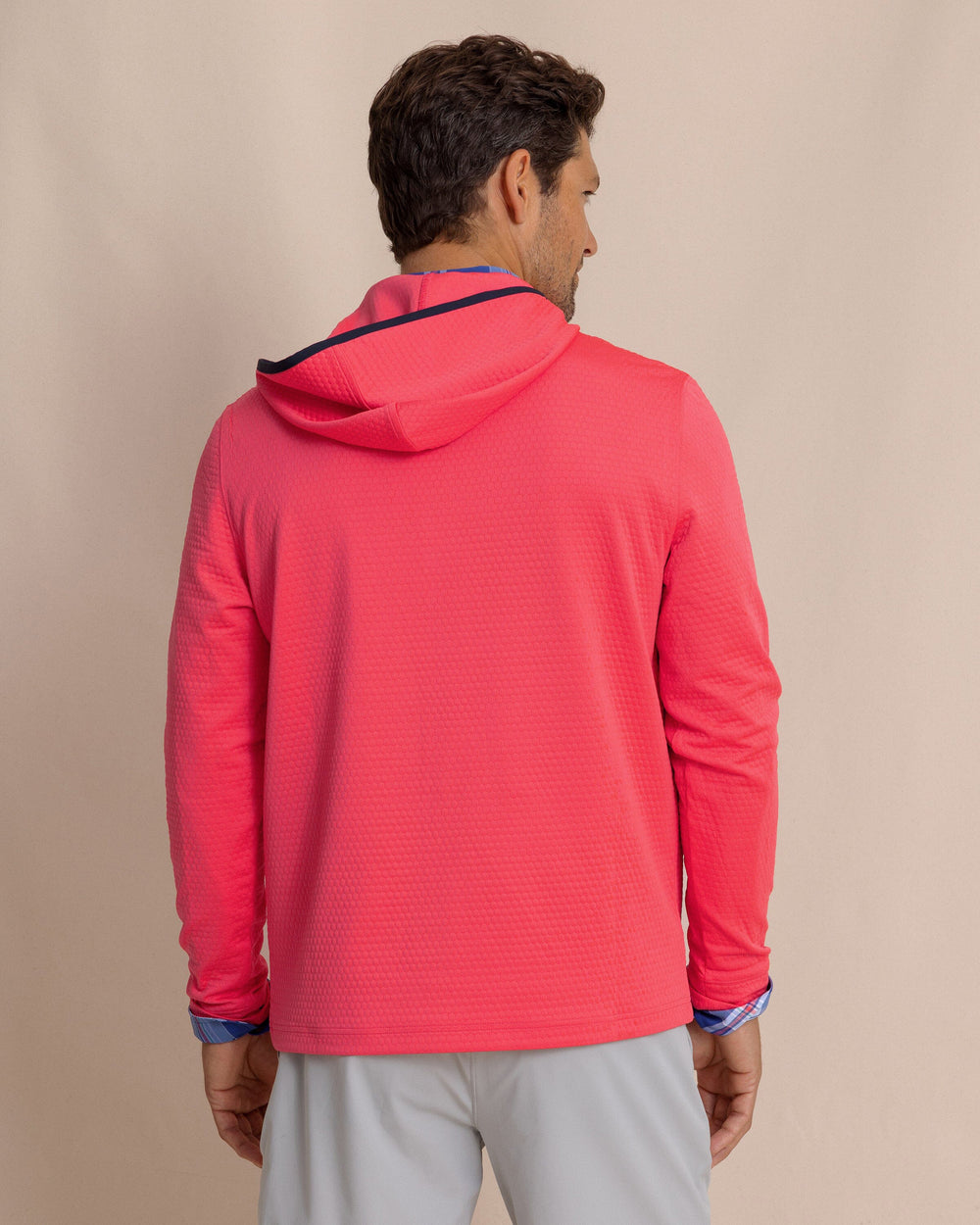 The back view of the Southern Tide Scuttle Performance Quarter Zip Hoodie by Southern Tide - Heather Snapper