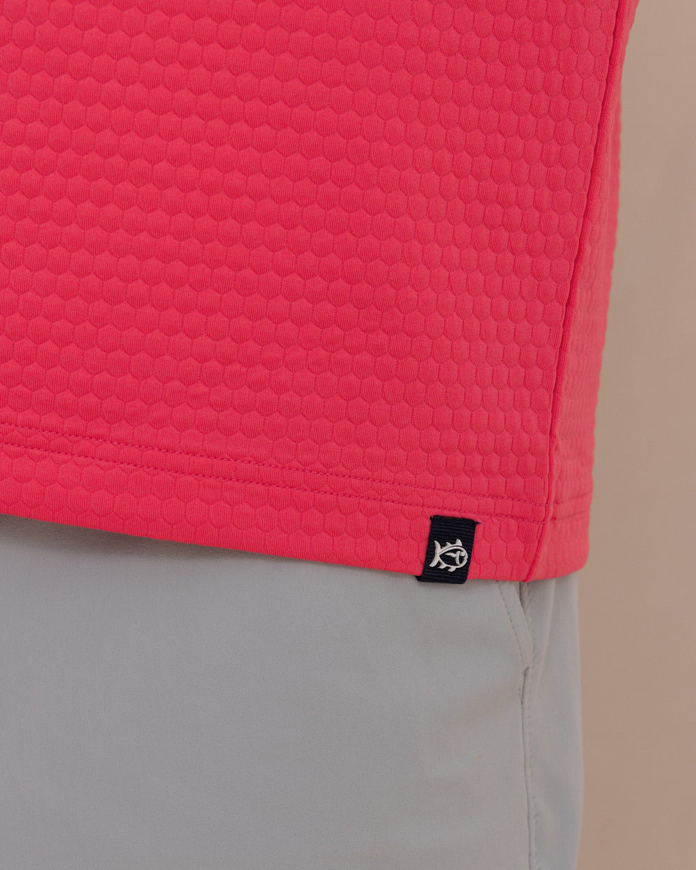 The detail view of the Southern Tide Scuttle Performance Quarter Zip Hoodie by Southern Tide - Heather Snapper