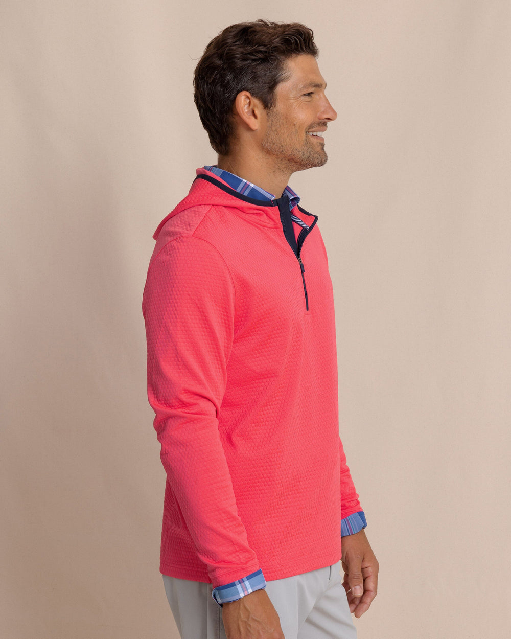 The side view of the Southern Tide Scuttle Performance Quarter Zip Hoodie by Southern Tide - Heather Snapper