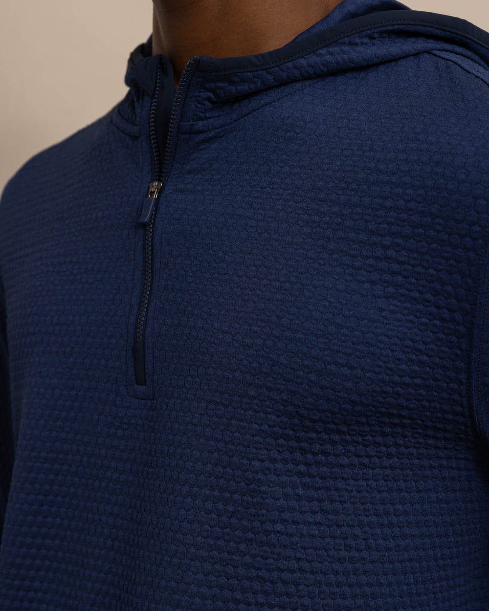 The detail view of the Southern Tide Scuttle Performance Quarter Zip Hoodie by Southern Tide - Heather True Navy