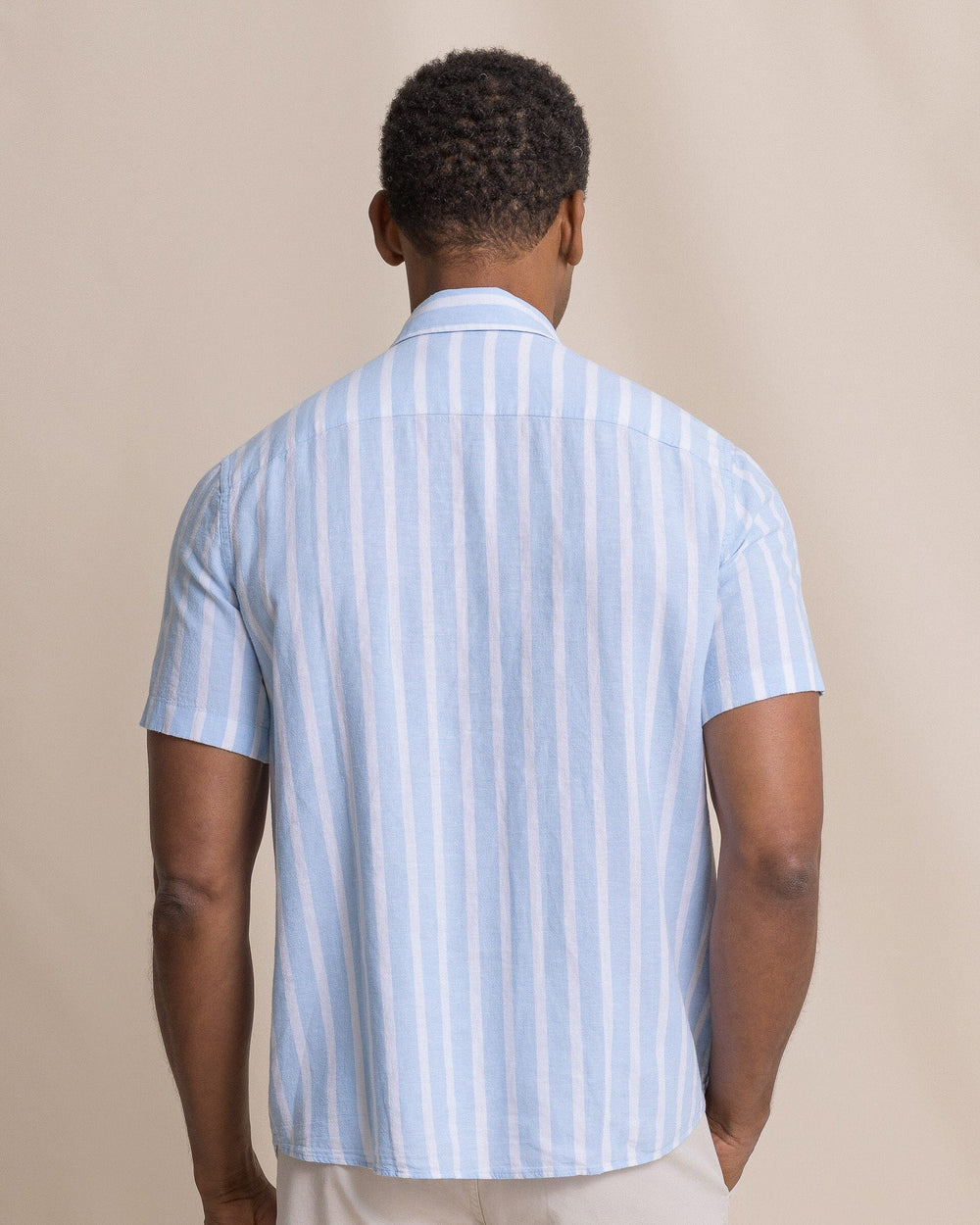 The back view of the Southern Tide Seamark Stripe Linen Rayon Short Sleeve Sport Shirt by Southern Tide - Tide Blue