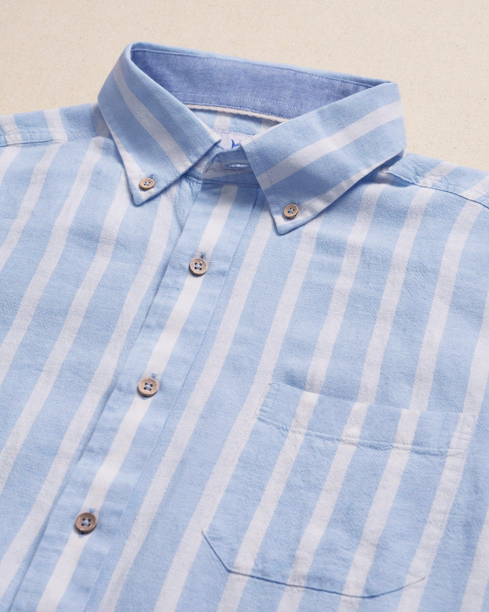 The detail view of the Southern Tide Seamark Stripe Linen Rayon Short Sleeve Sport Shirt by Southern Tide - Tide Blue