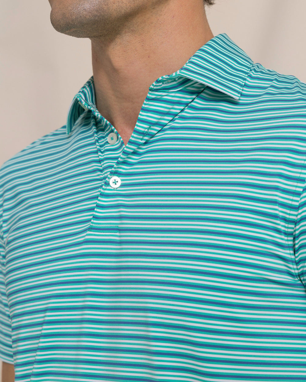 The detail view of the Southern Tide Shipwatch Stripe Coastal Breeze® Performance Polo by Southern Tide - Persian Green