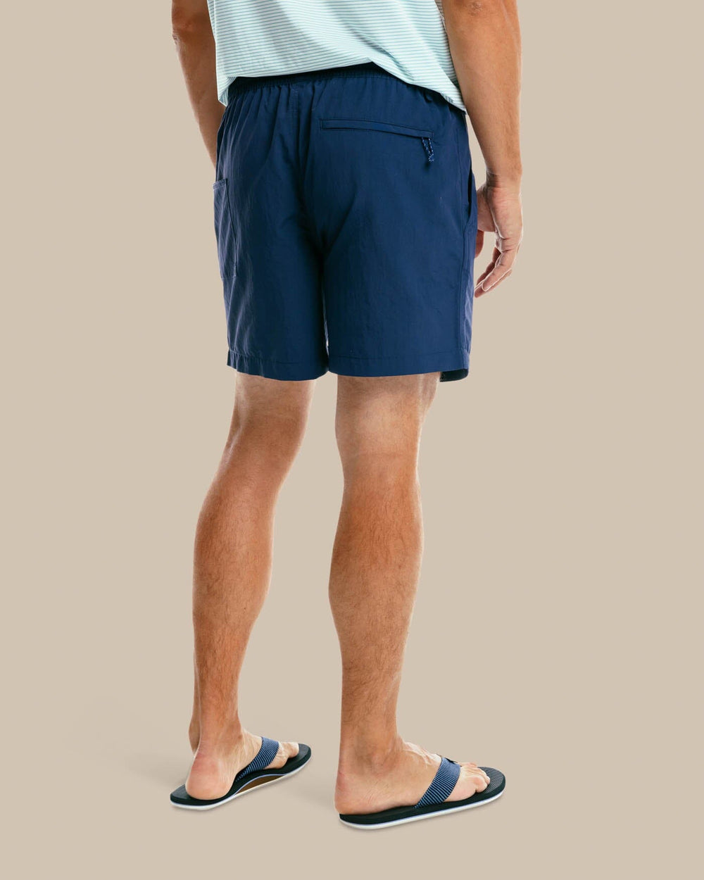 The model back view of the Men's Shoreline 6 Inch Short by Southern Tide  - True Navy