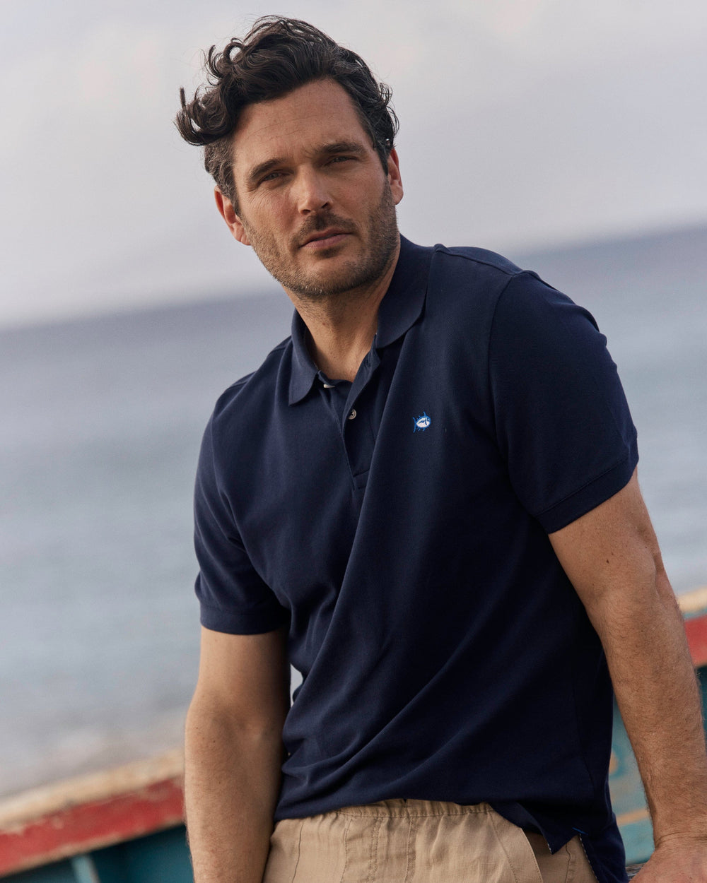 The lifestyle view of the Southern Tide Skipjack Polo Shirt by Southern Tide - True Navy