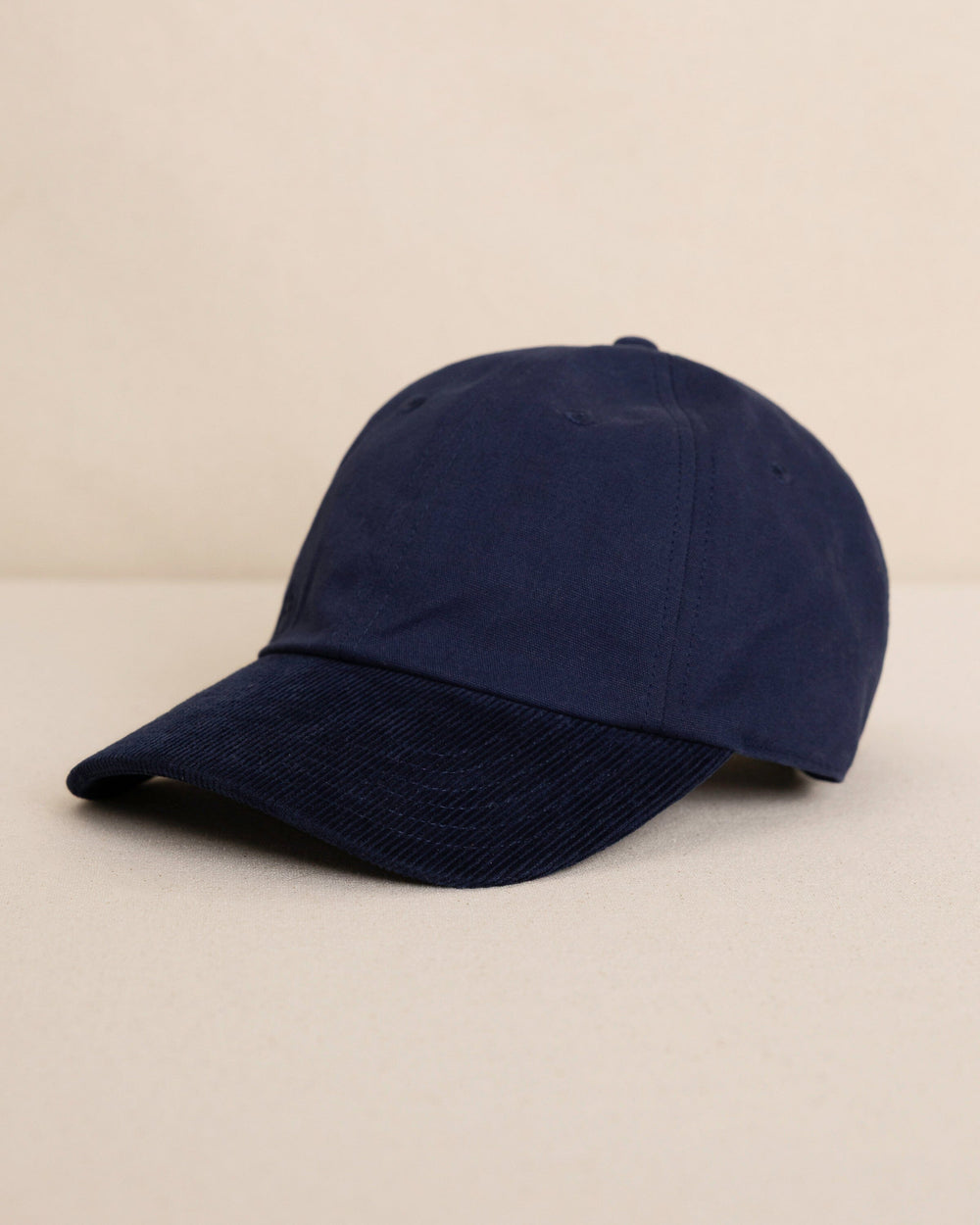 The front view of the Southern Tide Skipjack Canvas Leather Strap Hat by Southern Tide - Navy