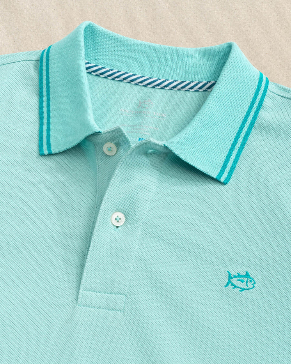 The detail view of the Southern Tide Skipjack Coastal Breeze® Pique Polo by Southern Tide - Tame Teal