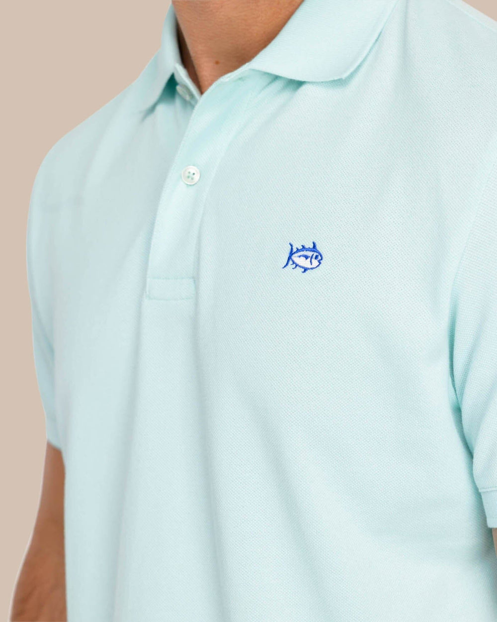 The model detail view of the Men's New Skipjack Polo Shirt by Southern Tide - Baltic Teal