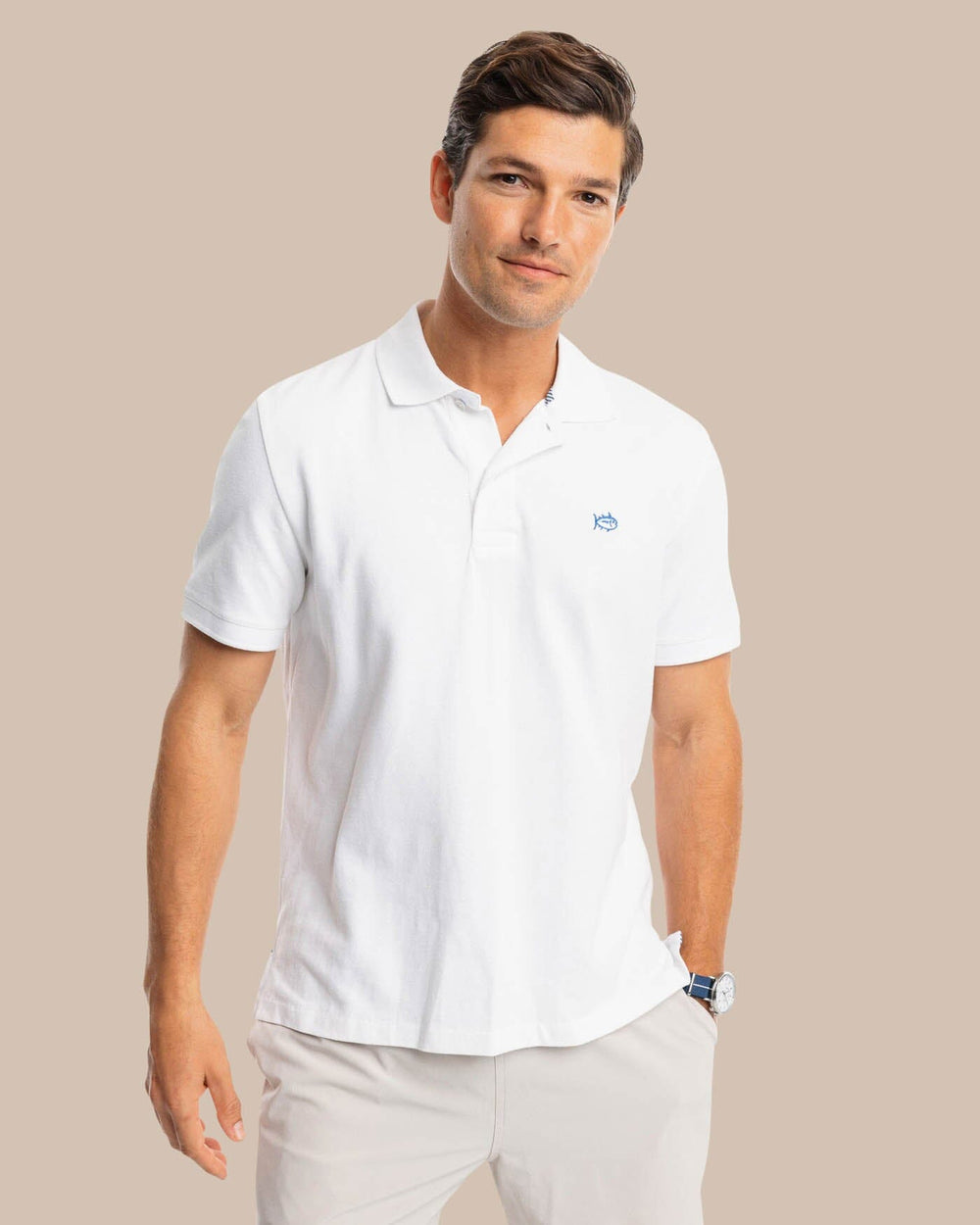 The model front view of the Men's New Skipjack Polo Shirt by Southern Tide - Classic White