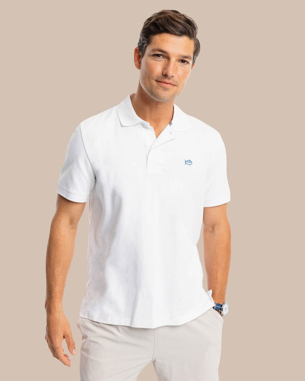 The model front view of the Men's New Skipjack Polo Shirt by Southern Tide - Classic White
