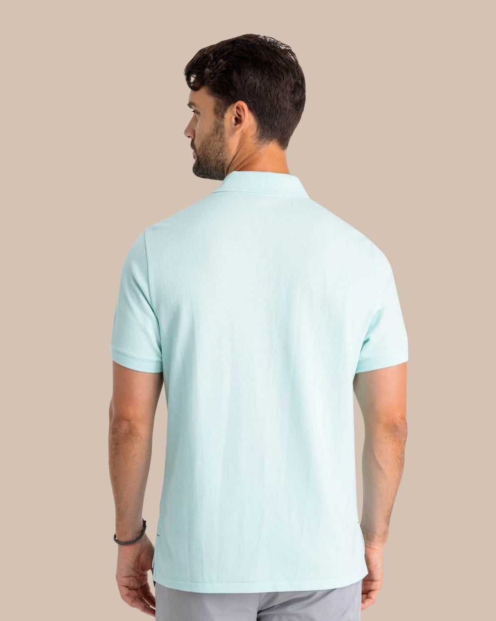 The back view of the Southern Tide Men's New Skipjack Polo Shirt by Southern Tide - Baltic Teal