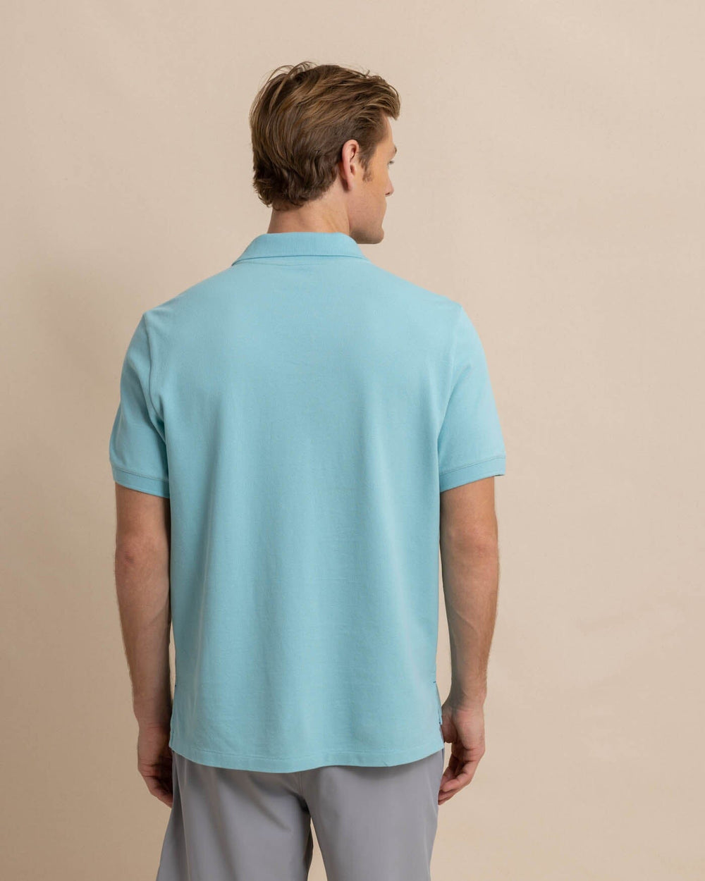 The back view of the skipjack-polo-shirt-sale by Southern Tide - Marine Blue