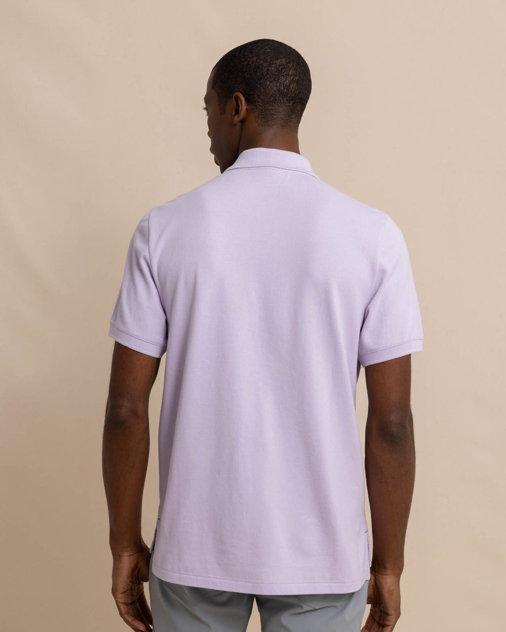 The back view of the skipjack-polo-shirt-sale by Southern Tide - Orchid Petal