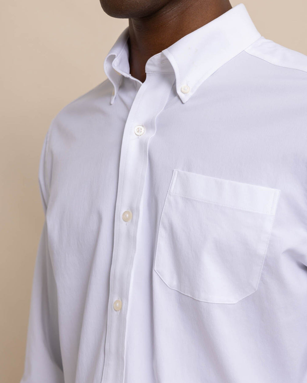 The front view of the Men's Solid Brrr® Intercoastal Performance Sport Shirt by Southern Tide - Classic White