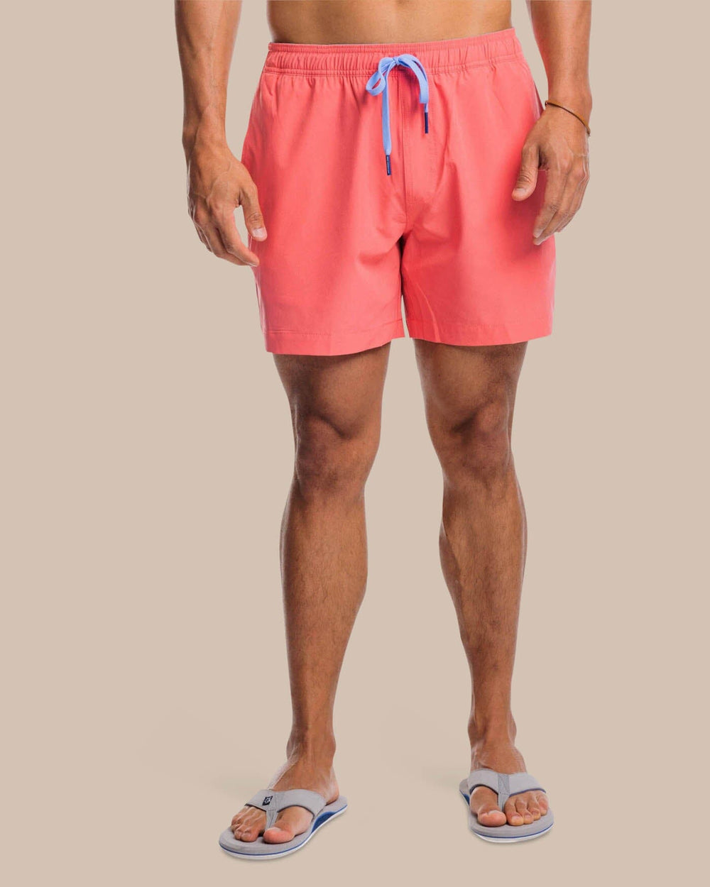 The front view of the Southern Tide Solid Swim Trunk 3 by Southern Tide - Sunkist Coral