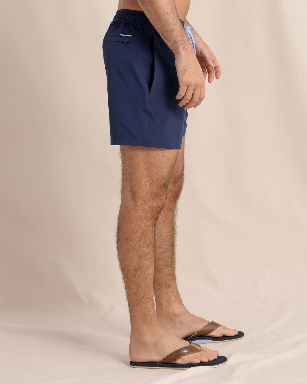 The side view of the Southern Tide Solid Swim Trunk by Southern Tide - True Navy