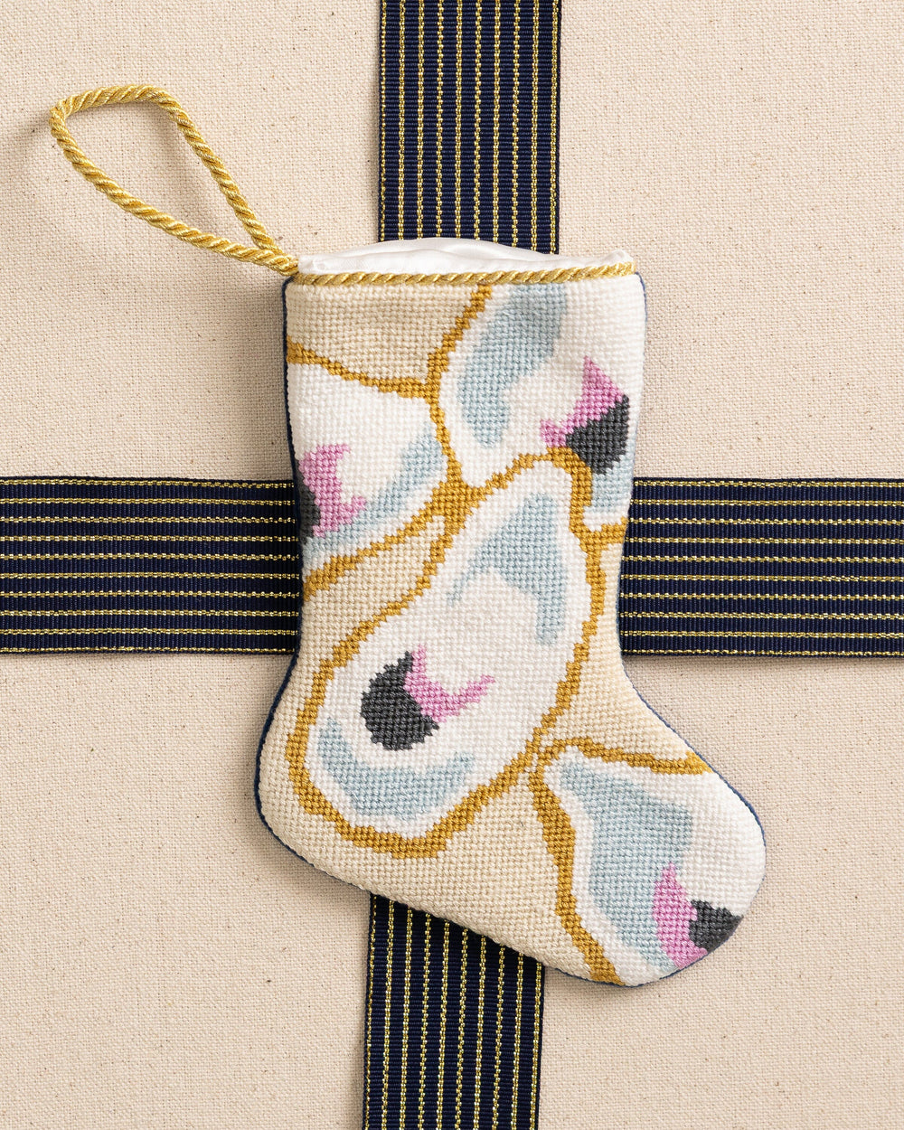 The front view of the Southern Tide Southern Oyster Needlepoint Stocking by Southern Tide - White