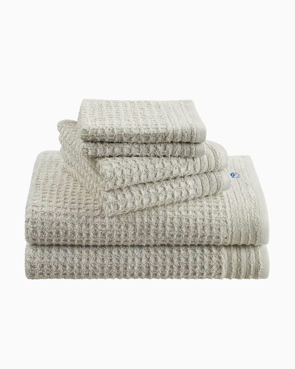 The front angle view of the Southern Tide 6 Pack Waffle Towel Set by Southern Tide - Harpoon Grey