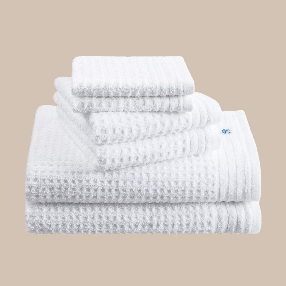 The front angle view of the Southern Tide 6 Pack Waffle Towel Set by Southern Tide - Optical White