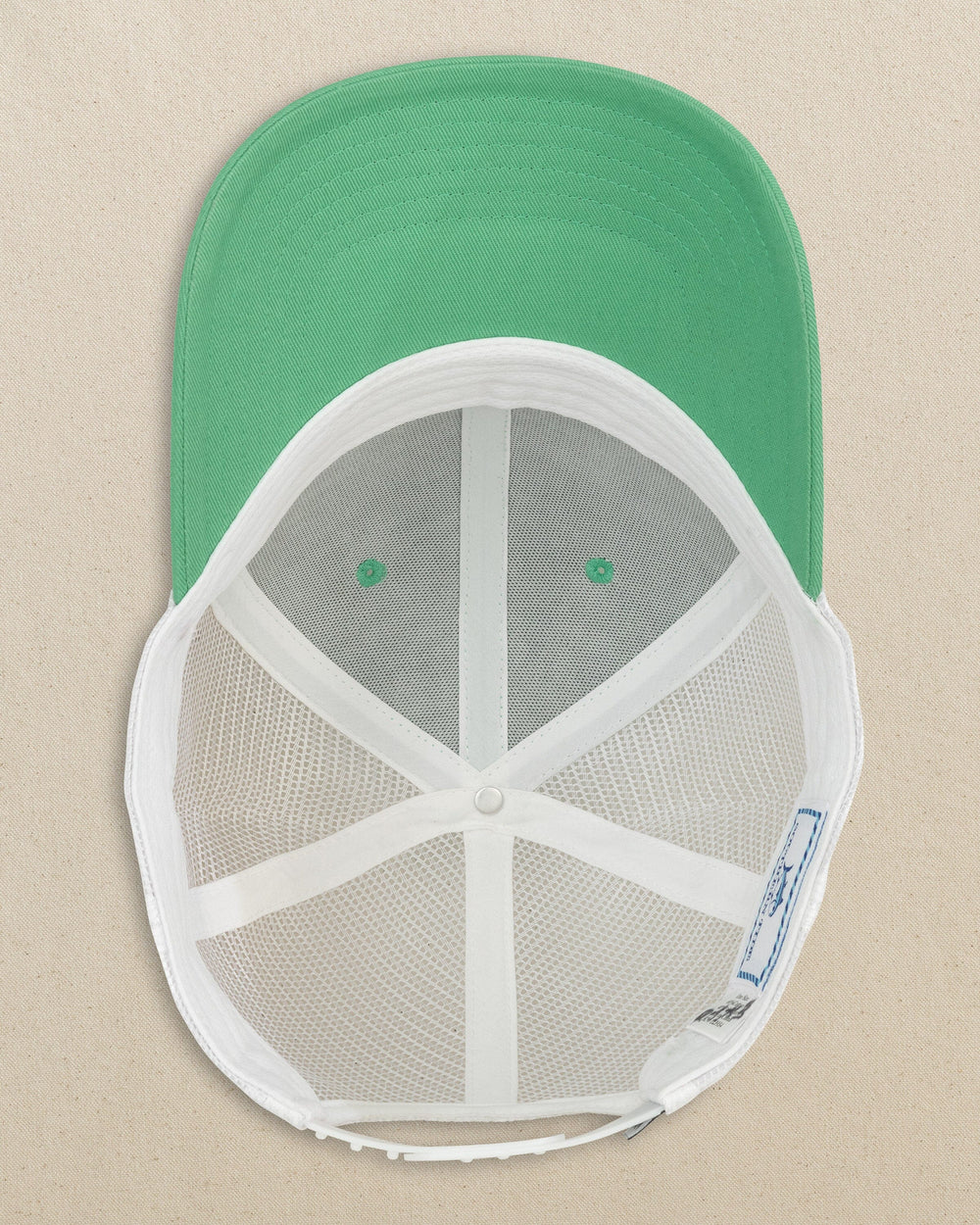 The detail view of the Southern Tide Arc Trucker Hat by Southern Tide - Jade Green