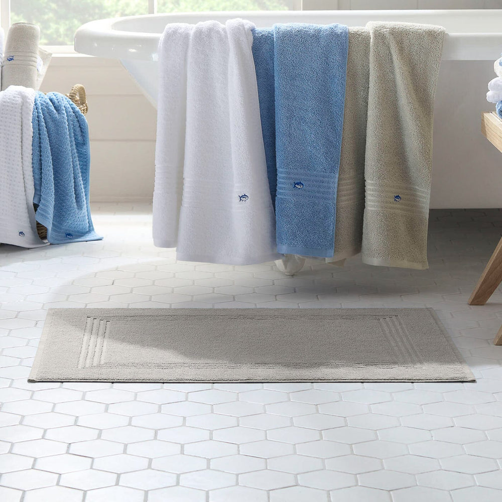 The lifestyle view of the Southern Tide Bath Mat by Southern Tide - Harpoon Grey