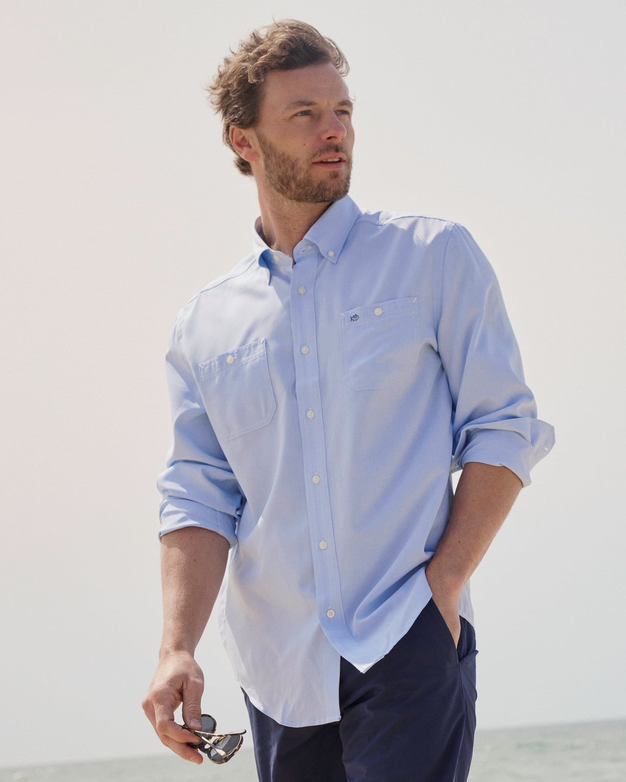 The lifestyle view of the Southern Tide Dock Shirt by Southern Tide - Cerulean