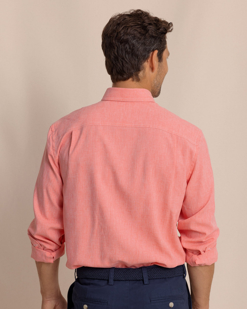 The back view of the Southern Tide Dock Shirt by Southern Tide - Sunkist Coral
