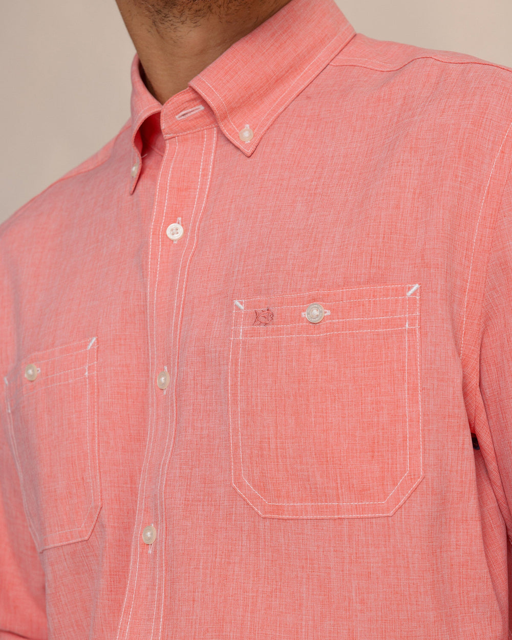 The detail view of the Southern Tide Dock Shirt by Southern Tide - Sunkist Coral