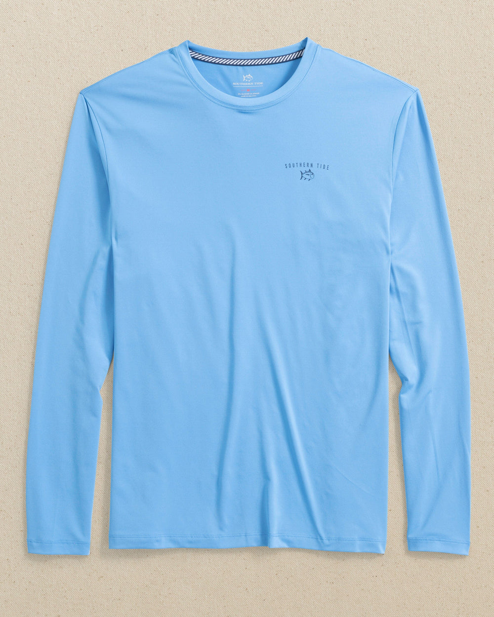 The front view of the Southern Tide Spearfishing Badge Long Sleeve Performance T-Shirt by Southern Tide - Boat Blue