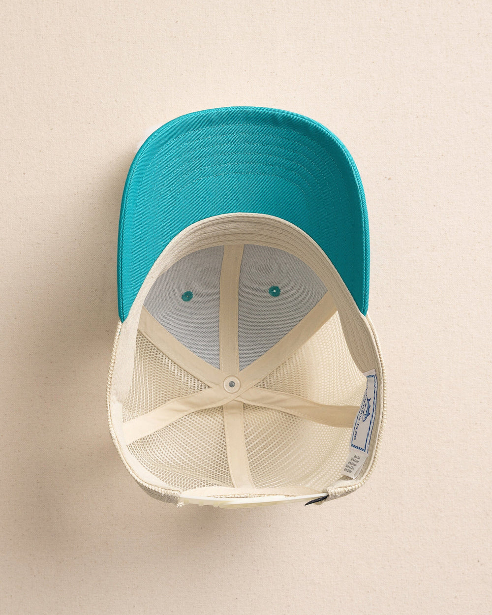 The under view of the Southern Tide ST Leather Patch Trucker Hat by Southern Tide - Spruce Shade