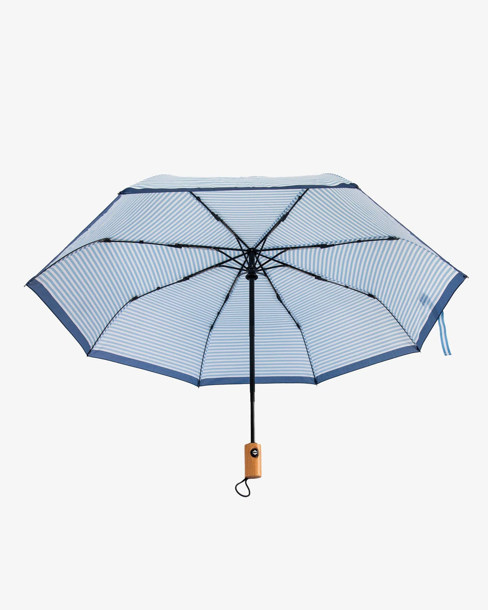 The front view of the Southern Tide Striped Folding Umbrella by Southern Tide - Clearwater Blue