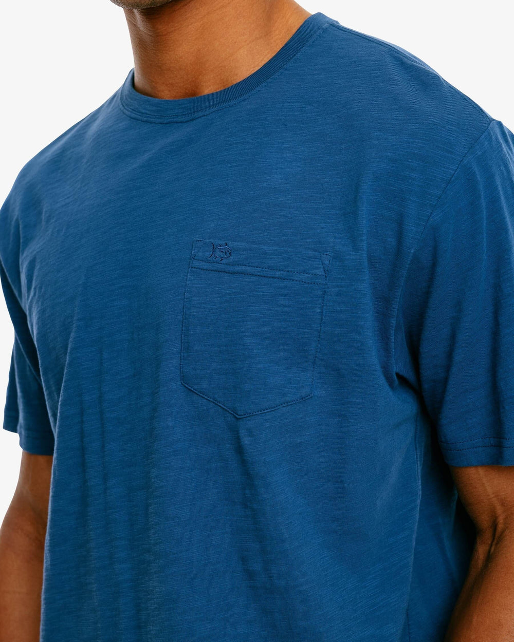 The pocket of the Men's Sun Farer Short Sleeve T-Shirt by Southern Tide - Dark Denim