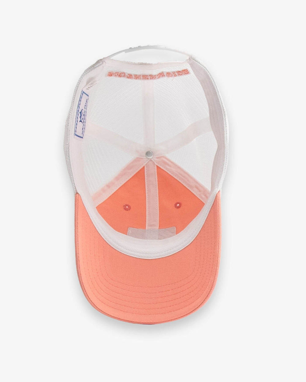 The detail view of the Southern Tide Sun Farer Skipjack Fly Patch Trucker Hat by Southern Tide - Apricot Blush Coral