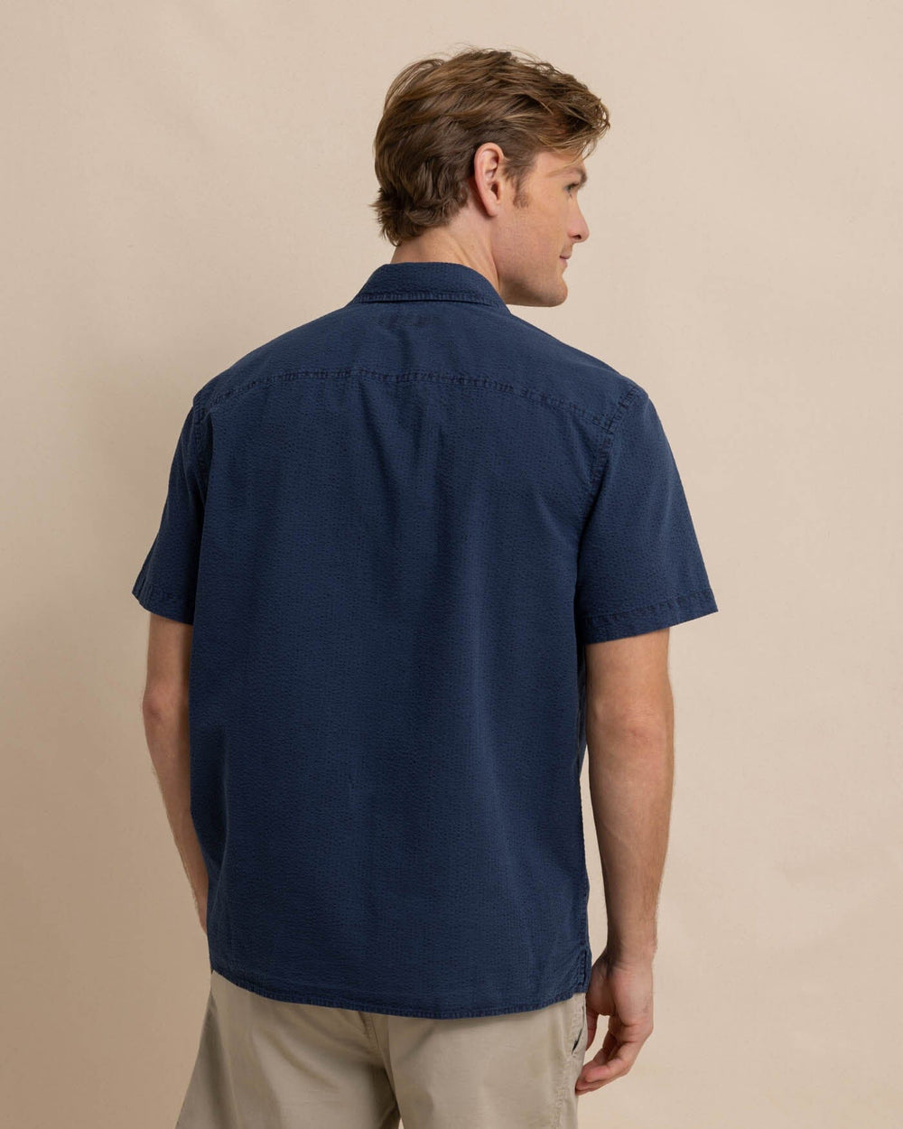 The back view of the Southern Tide Sun Washed Seerscuker Camp Short Sleeve Sport Shirt by Southern Tide - Dress Blue