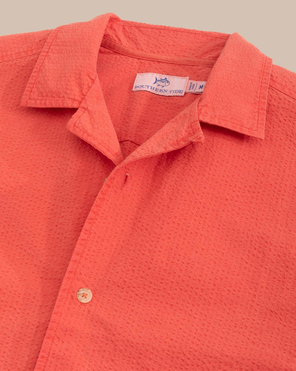 The detail view of the Southern Tide Sun Washed Seerscuker Camp Short Sleeve Sport Shirt by Southern Tide - Paprika Red