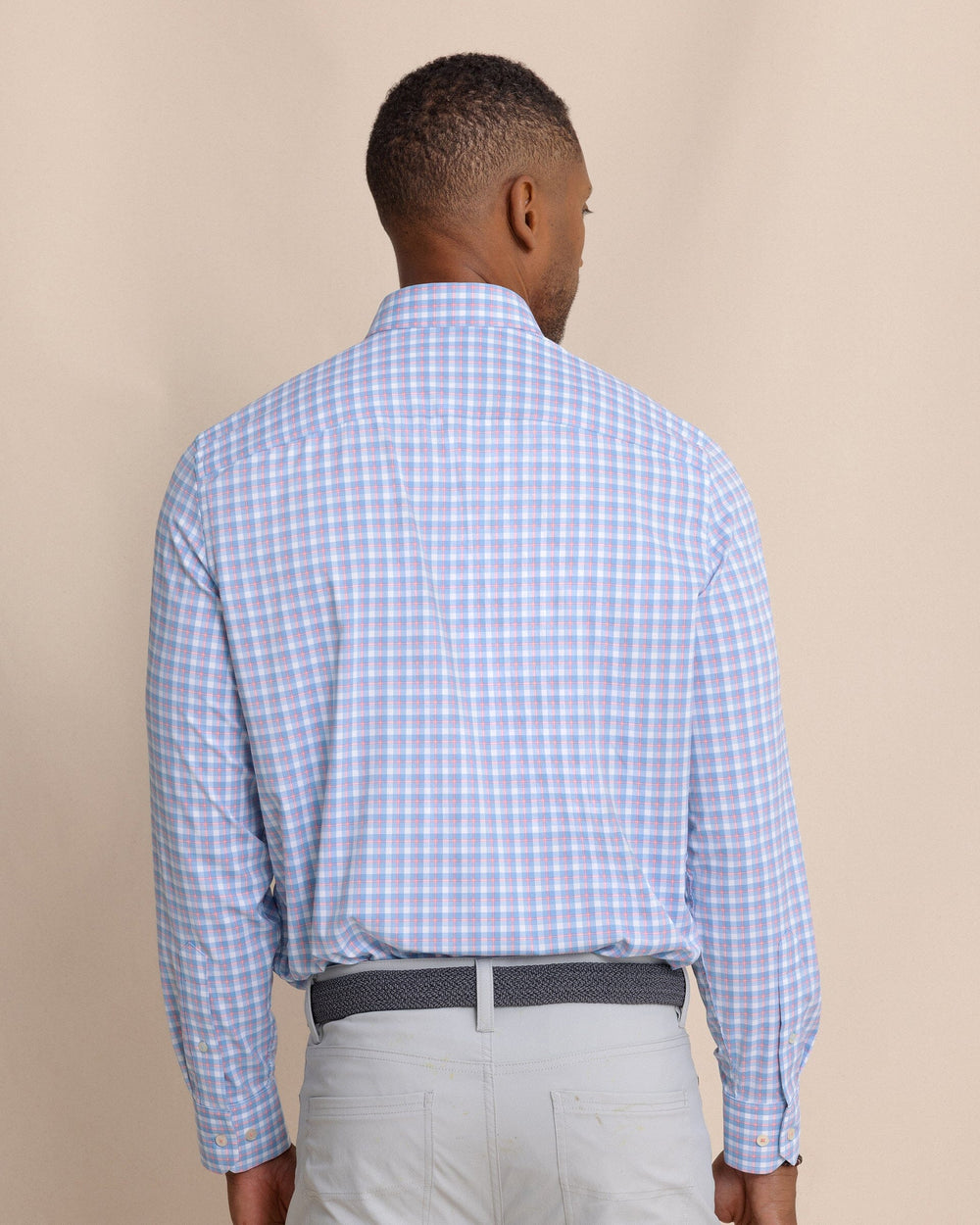 The back view of the Southern Tide Sunset Harbor brrr°® Intercoastal Sport Shirt by Southern Tide - Sunkist Coral