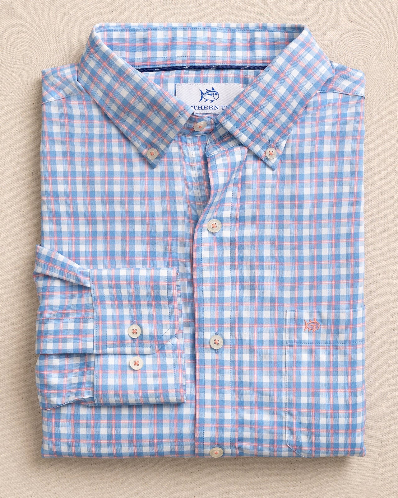 The front view of the Southern Tide Sunset Harbor brrr°® Intercoastal Sport Shirt by Southern Tide - Sunkist Coral