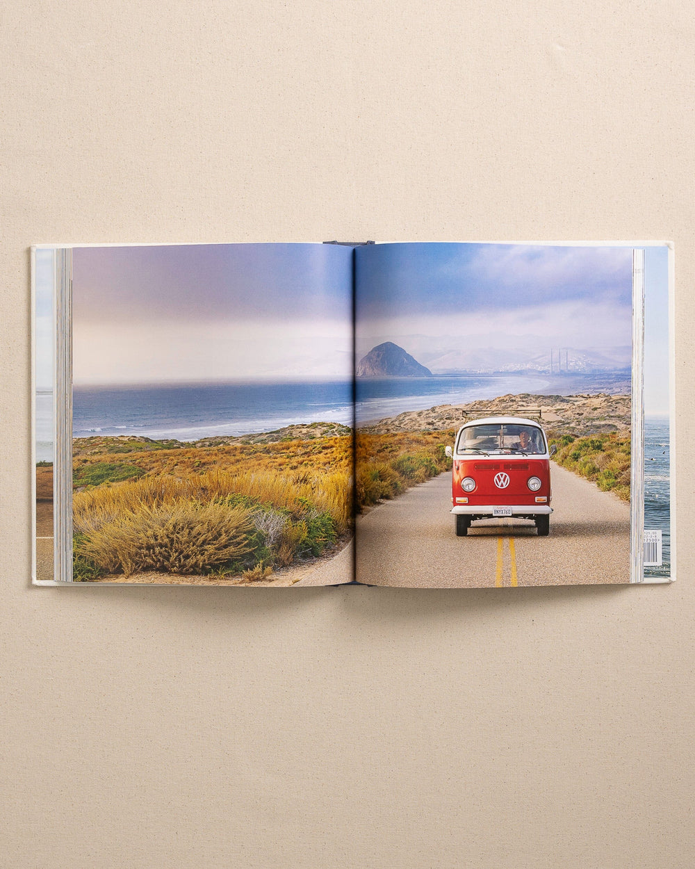 The detail view of the Johnny Vacay Surf Rides Coffee Table Book at Southern Tide - White